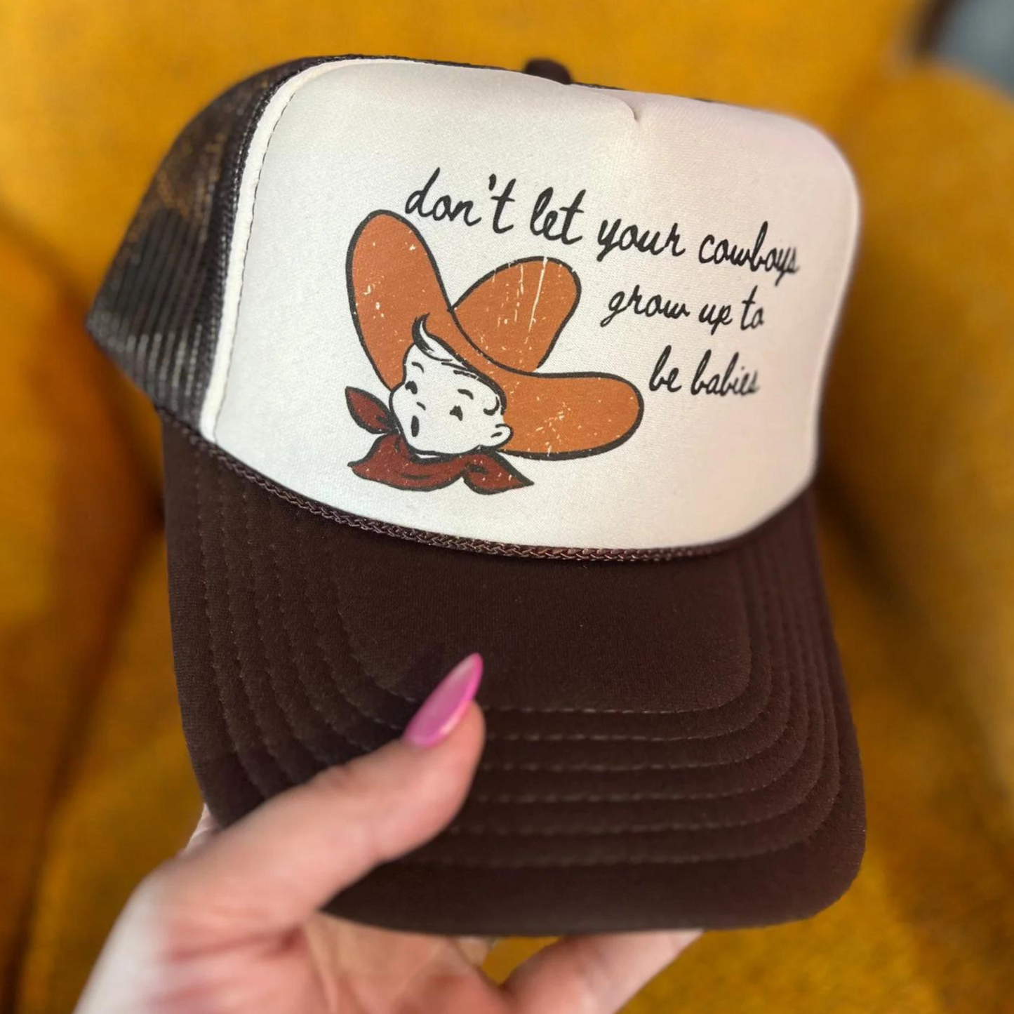 Online Exclusive | Don't Let Your Cowboys Grow Up To Be Babies Foam Trucker Cap in Brown and Cream