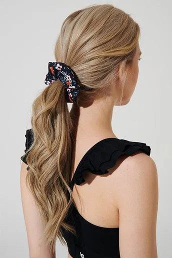 Orange scrunchie headwear for women, perfect accessory to add a pop of color.